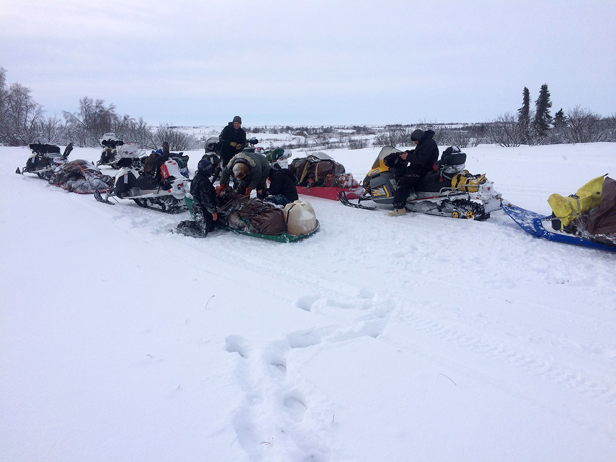 Moose Meet - hunters on snowmobiles