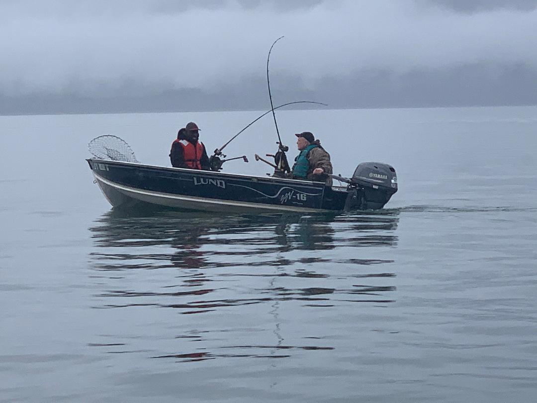 Mark and Andrew fishing on a boat