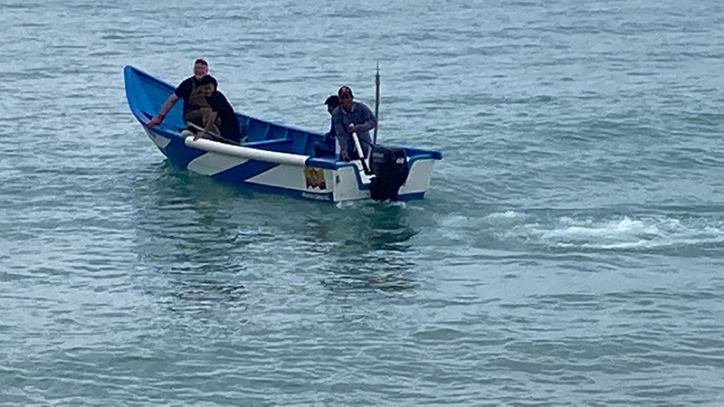 Mark and fishermen in boat