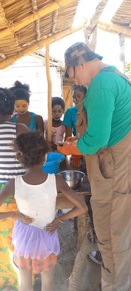 Mark and women and kids salting fish in Madagascar