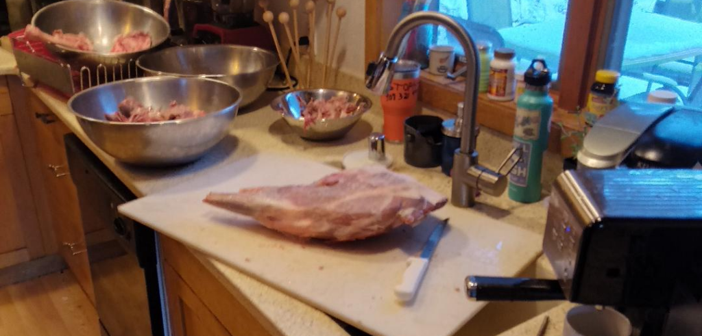 deer meat on cutting board in a kitchen